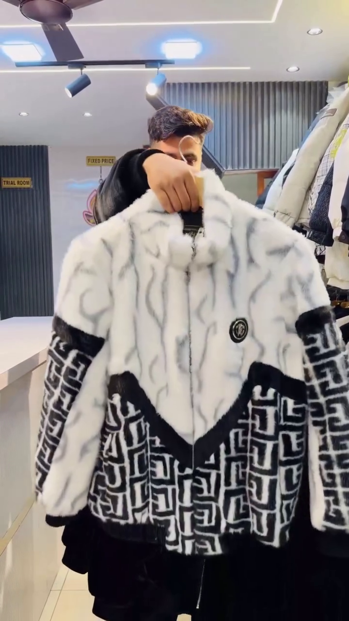 Black & White Faux‑Fur Zip‑Up Winter Jacket with Geometric Panel Detailing and Badge Accent for Men” 🖤🤍