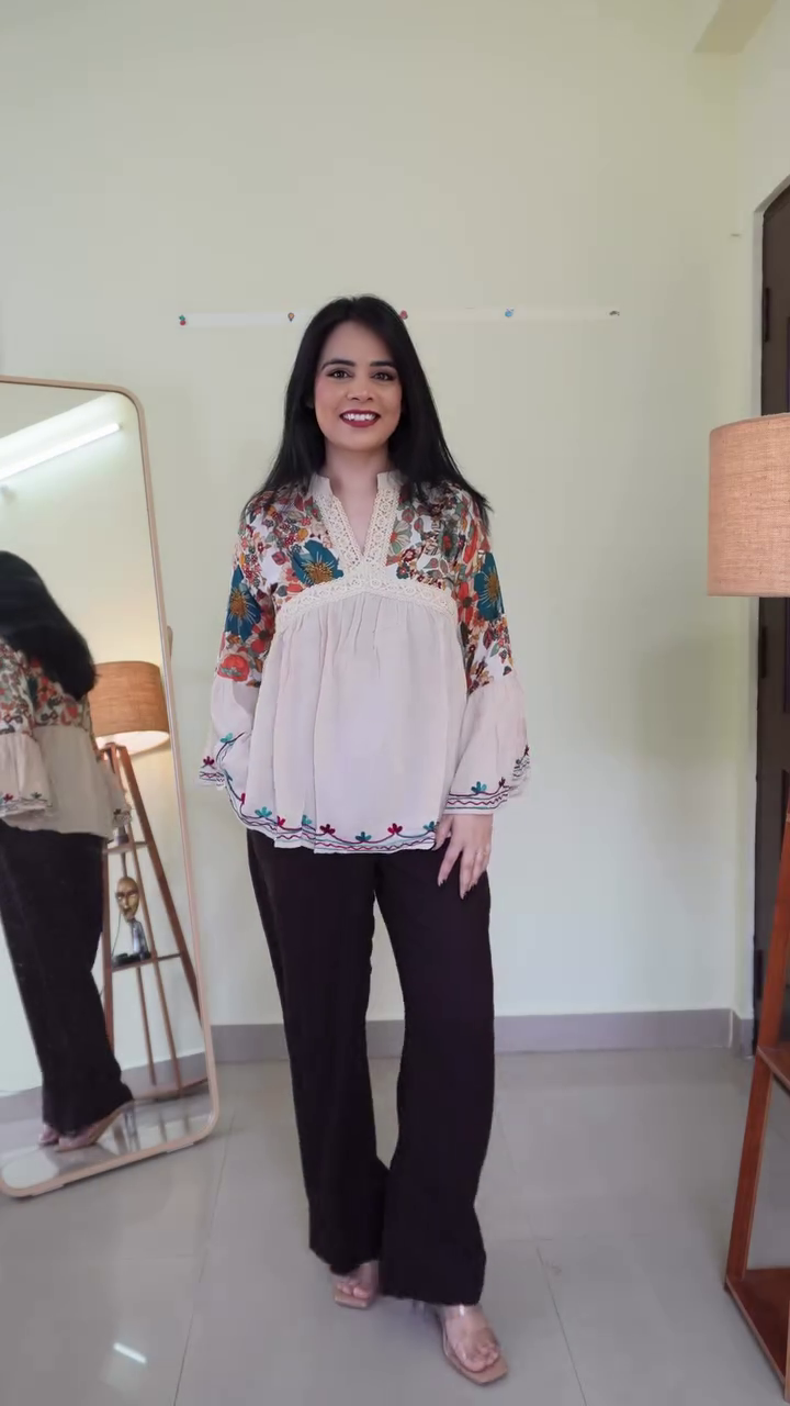 Black Floral Embroidered Peplum Top with Flared Sleeves & Contrast Red-Green Thread Detailing – Elegant Casual Statement Blouse