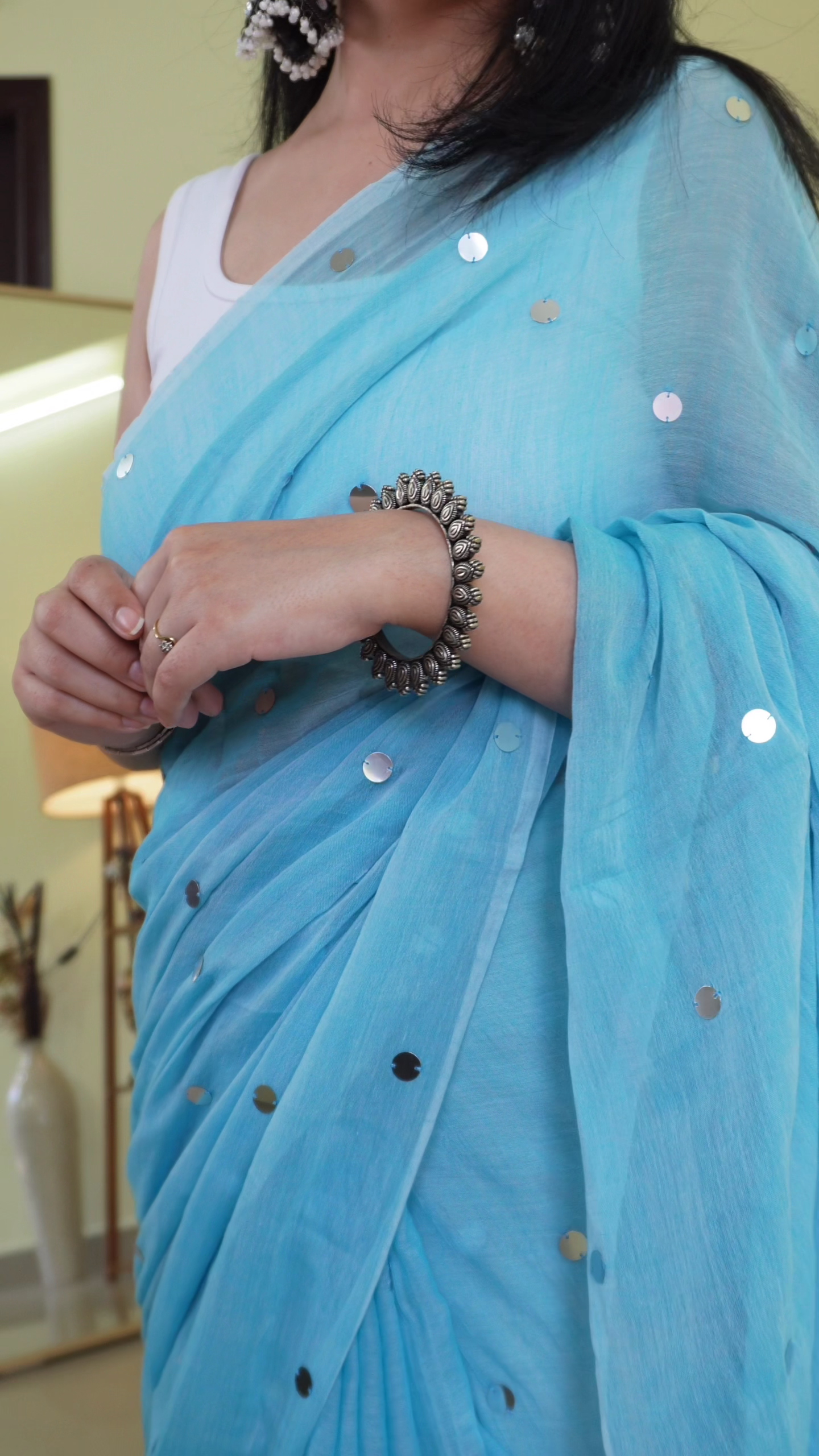Aqua Blue Lightweight Chiffon Saree with Silver Sequin Polka Detailing & Minimalist Sleeveless Blouse – Graceful Daytime & Festive Ethnic Ensemble