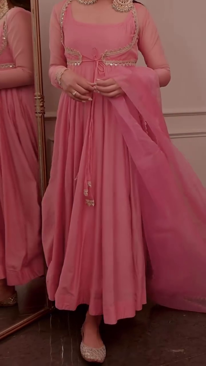 Blush Pink Anarkali Style Floor-Length Gown with Sheer Full Sleeves, Empire Waist Tie-Up & Intricate Golden Embellished Border Detailing – Festive Wedding Celebration Ensemble
