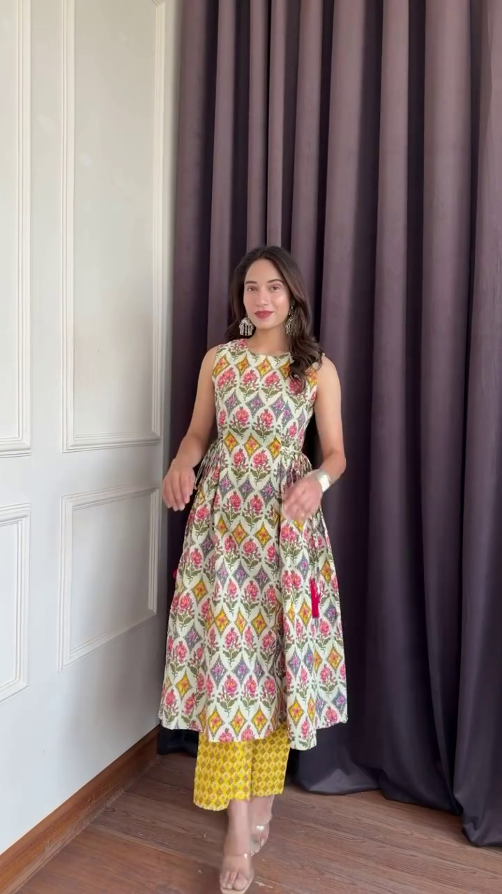 Sleeveless Pink-Red-White Floral Flared Dress Layered Over Turquoise Floral Pants with Beige Heels and Ornate Earrings Fusion Fashion Ensemble 🌸👗👖👠✨