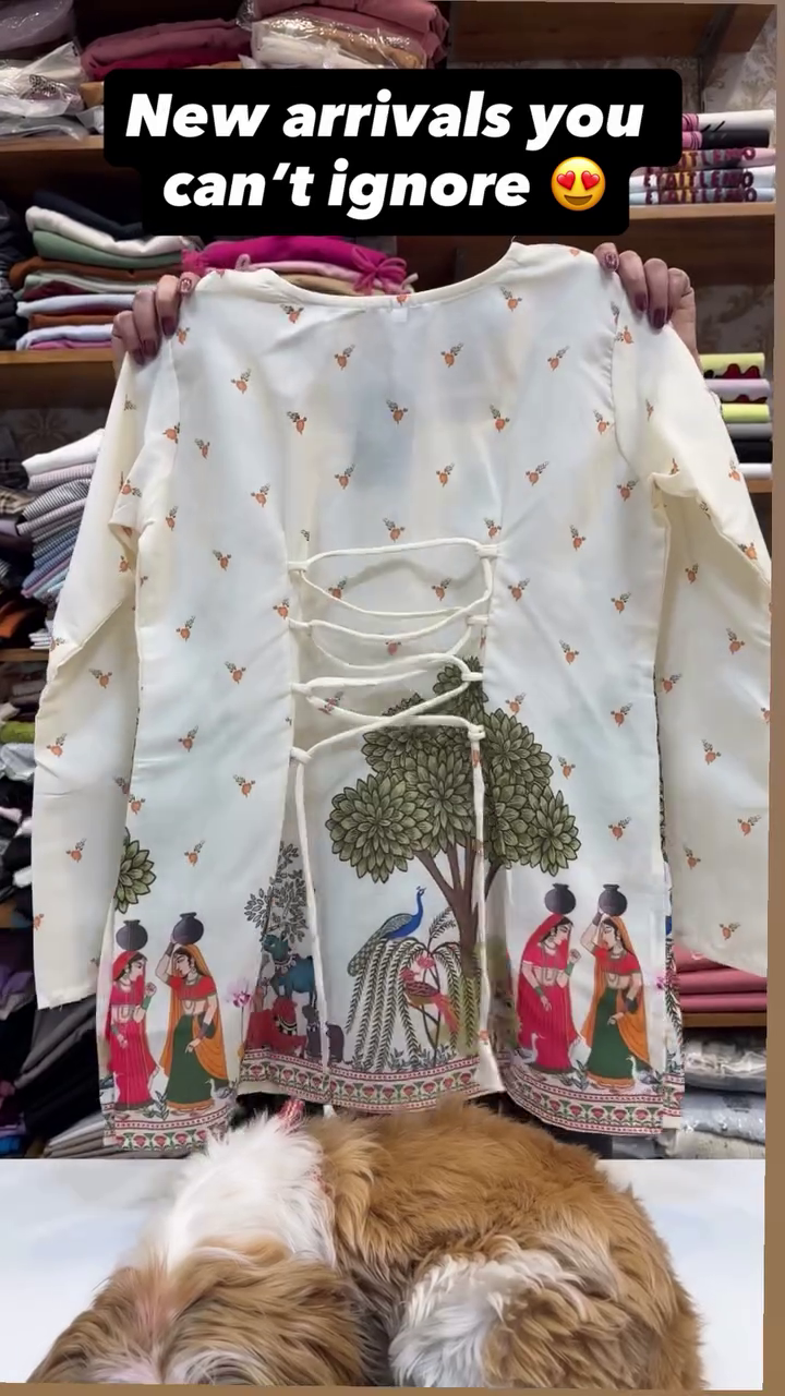 Cream Traditional Kurta with Pastoral Printed Scene Featuring Trees, Peacocks, Cows, and Woman Carrying Pot Alongside Small Floral Motifs Elegant Cultural Garment 🌿👗🦚🐄✨
