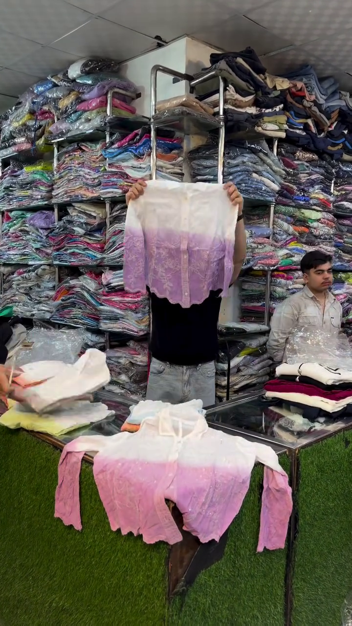 Pink and White Garment Displayed in Organized Clothing Store Retail Presentation Ensemble 🌸👕👖🛍️✨