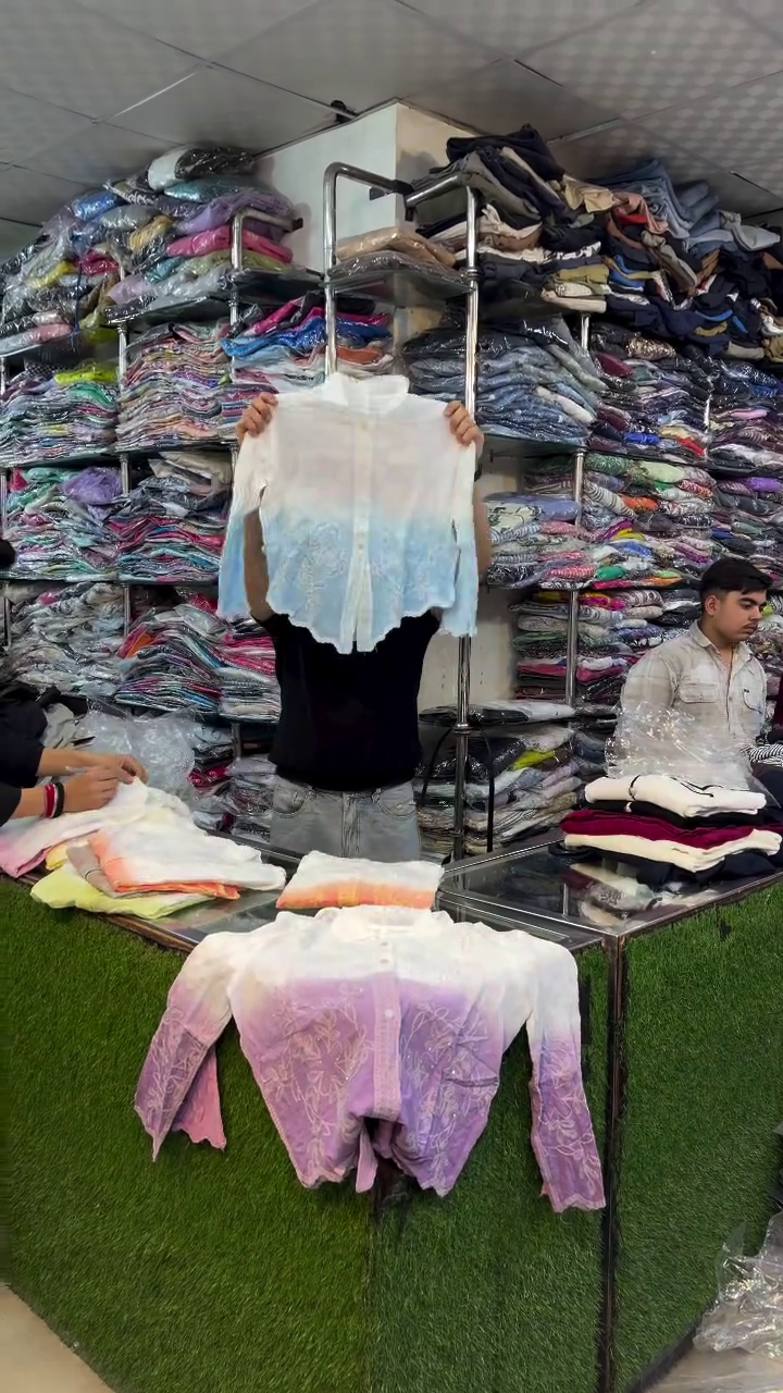 Pink and White Garment Displayed in Organized Clothing Store Retail Presentation Ensemble 🌸👕👖🛍️✨
