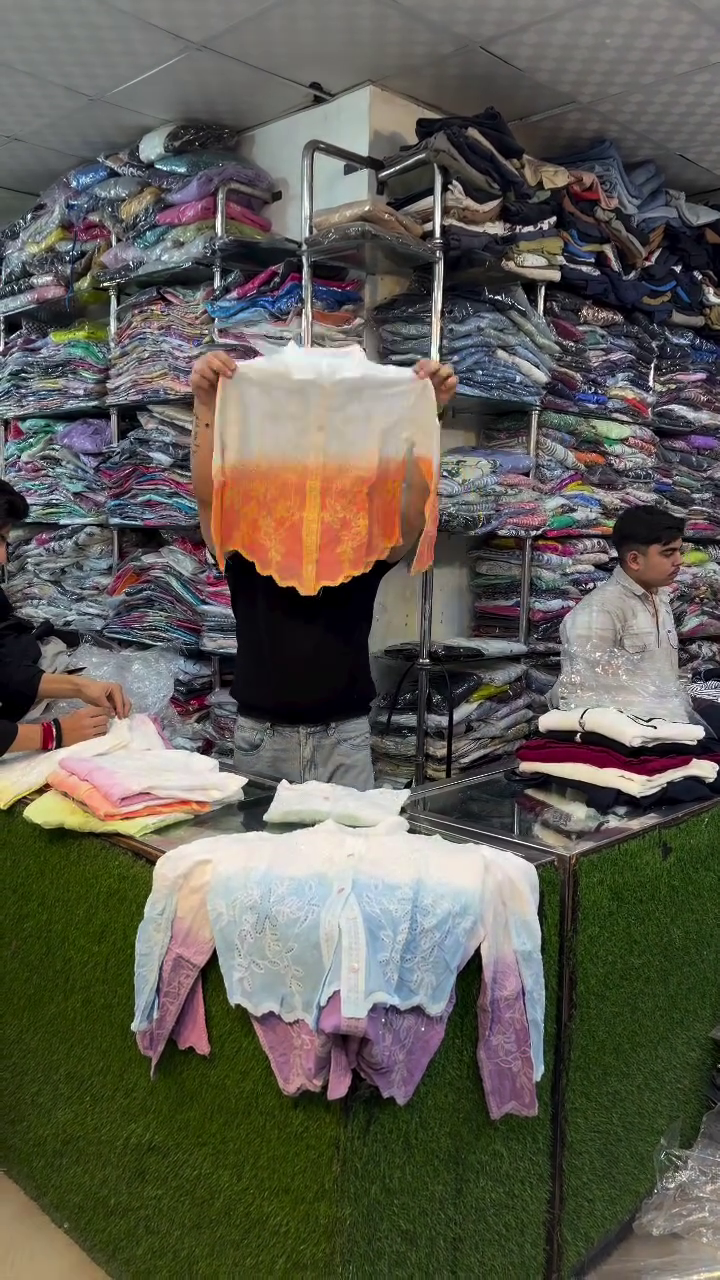 Pink and White Garment Displayed in Organized Clothing Store Retail Presentation Ensemble 🌸👕👖🛍️✨
